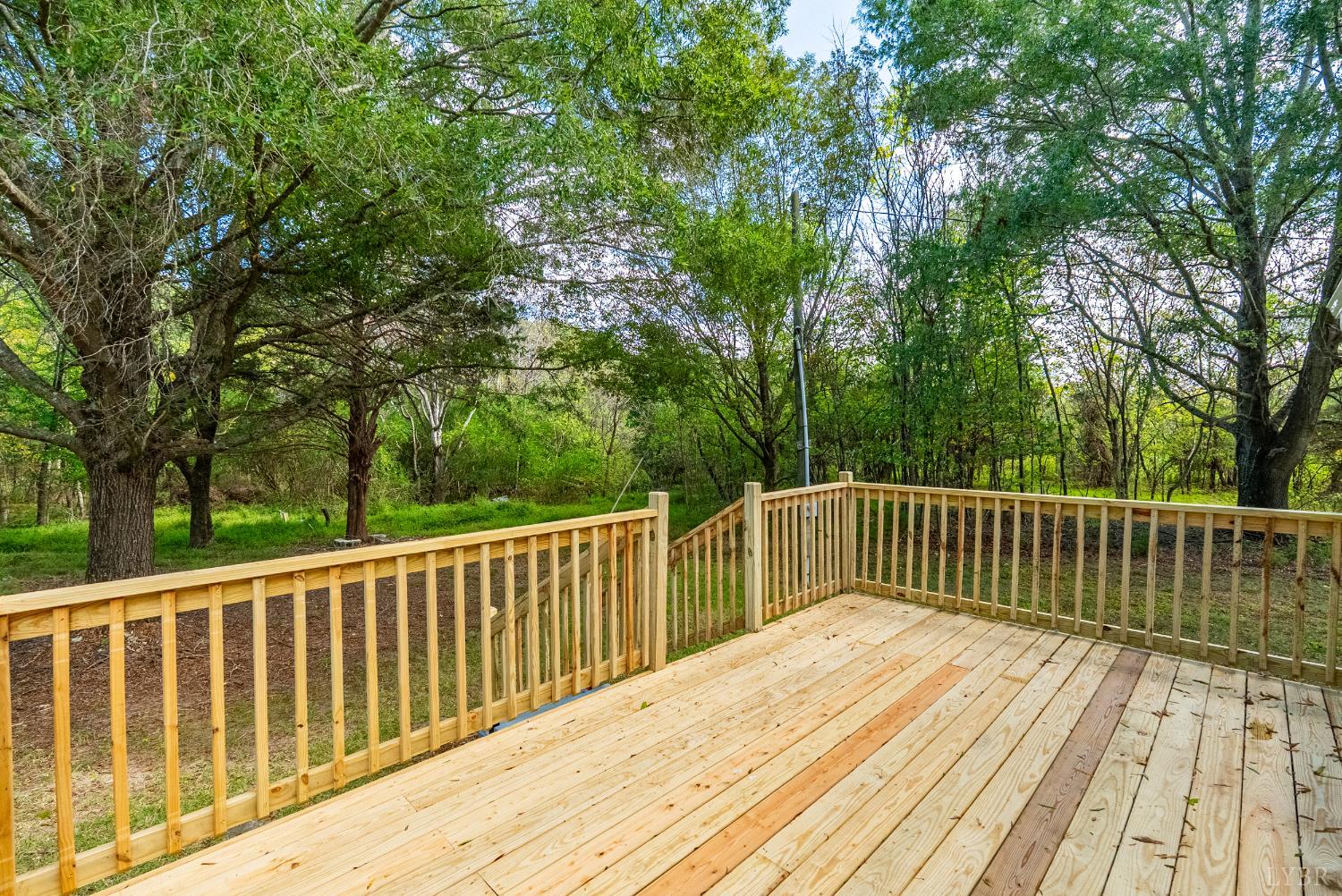 2141 Gap Road Chatham, VA 24531 - Photo 6 of 39 a balcony with wooden floor and fence