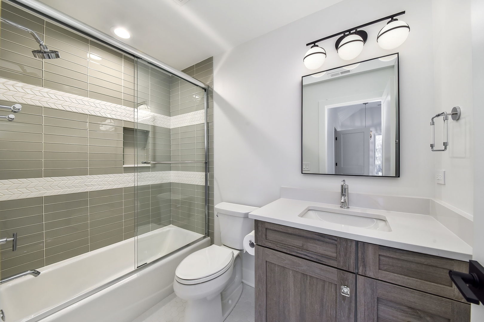 28W165 Geneva Road West Chicago, IL 60185 - Photo 12 of 18 a bathroom with a sink a toilet and shower