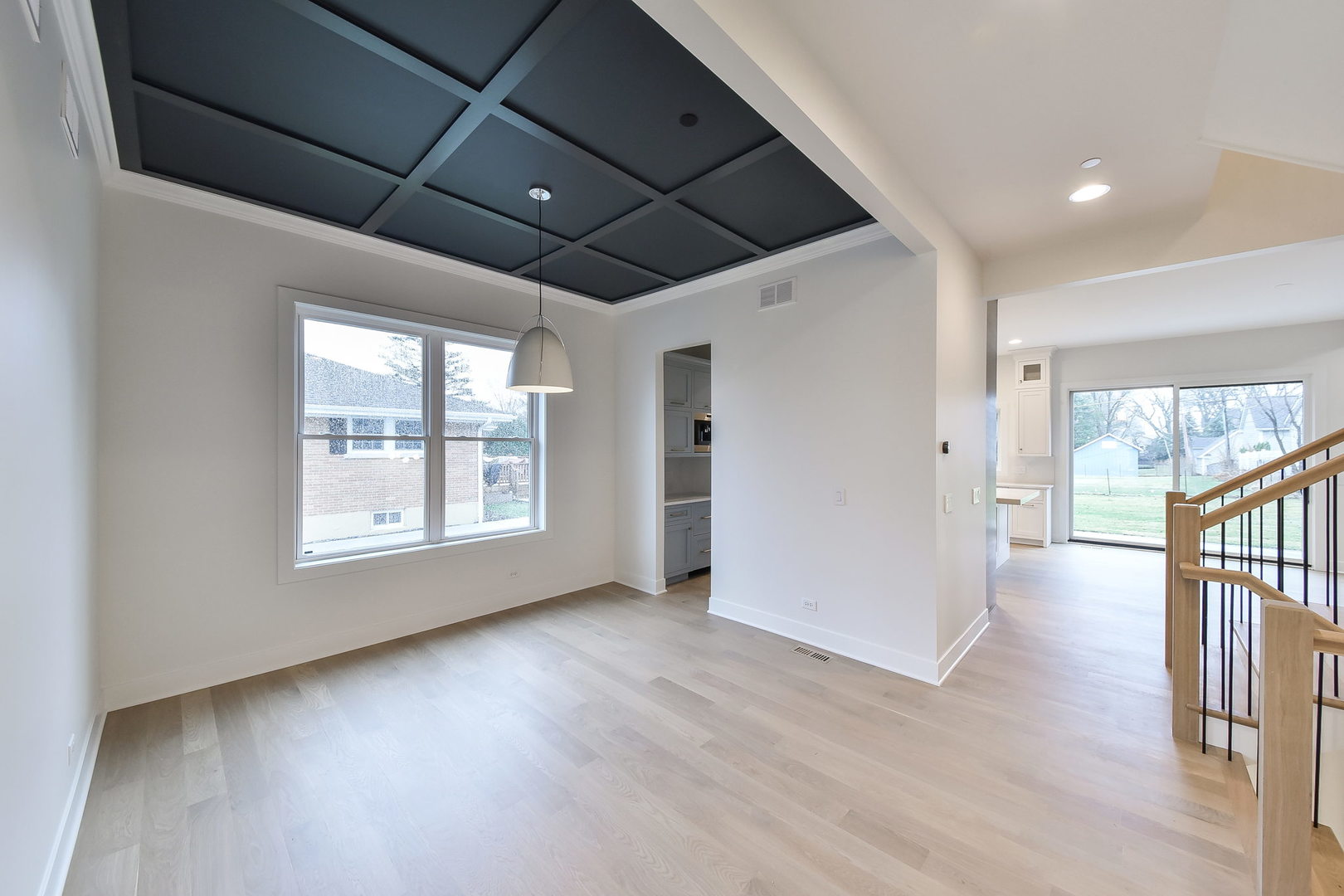 28W165 Geneva Road West Chicago, IL 60185 - Photo 7 of 18 a view of an empty room with wooden floor and a window