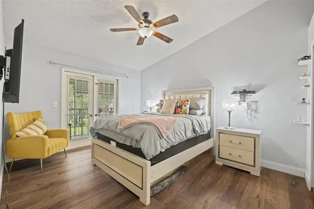 a spacious bedroom with a bed and a couch