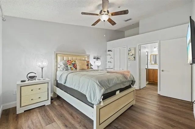 a spacious bedroom with a bed and a table