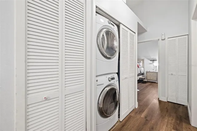 a view of a hallway with washer and dryer