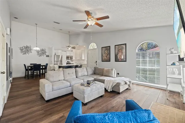 a living room with furniture and a large window