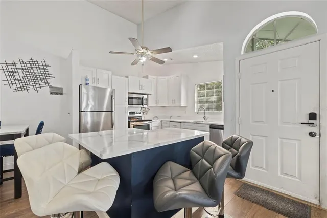a dining room with furniture and a chandelier
