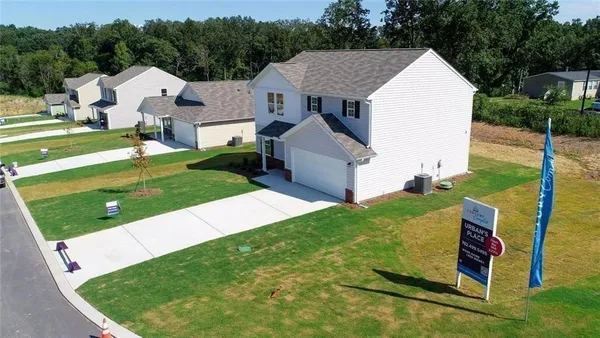 a view of a swimming pool with a yard