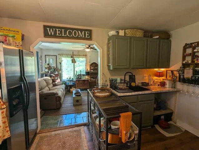 a kitchen with a sink appliances and cabinets