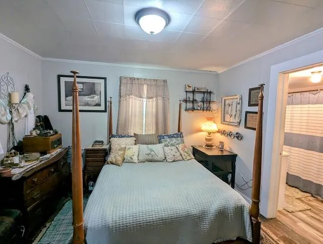 a bathroom with a sink toilet and window