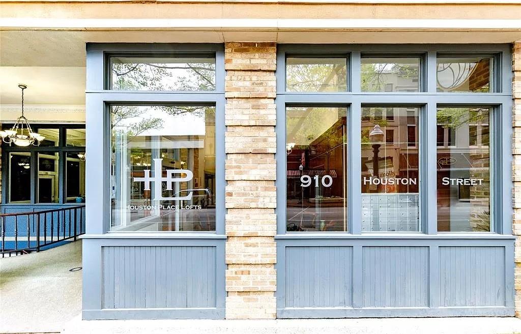 910 Houston Street, Unit 604 Fort Worth, TX 76102 - Photo 3 of 14 Property entrance with brick siding