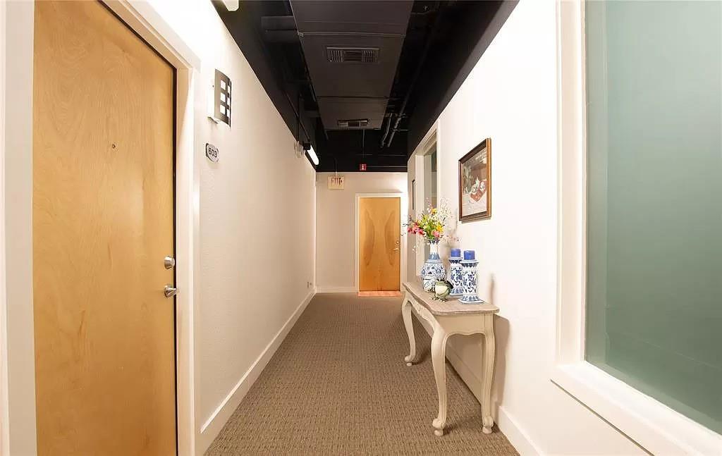 910 Houston Street, Unit 604 Fort Worth, TX 76102 - Photo 8 of 14 Hall featuring baseboards and carpet flooring