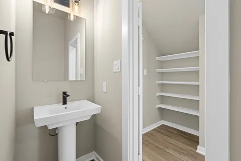 a bathroom with a sink and a mirror