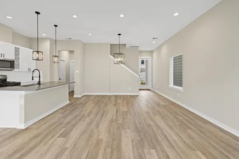a view of kitchen with wooden floor and window