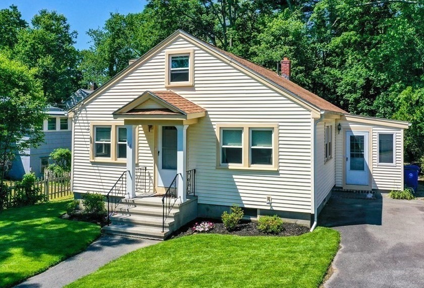 84 East Shore Road Holbrook, MA 02343 - Photo 1 of 26 a front view of a house with a yard and potted plants