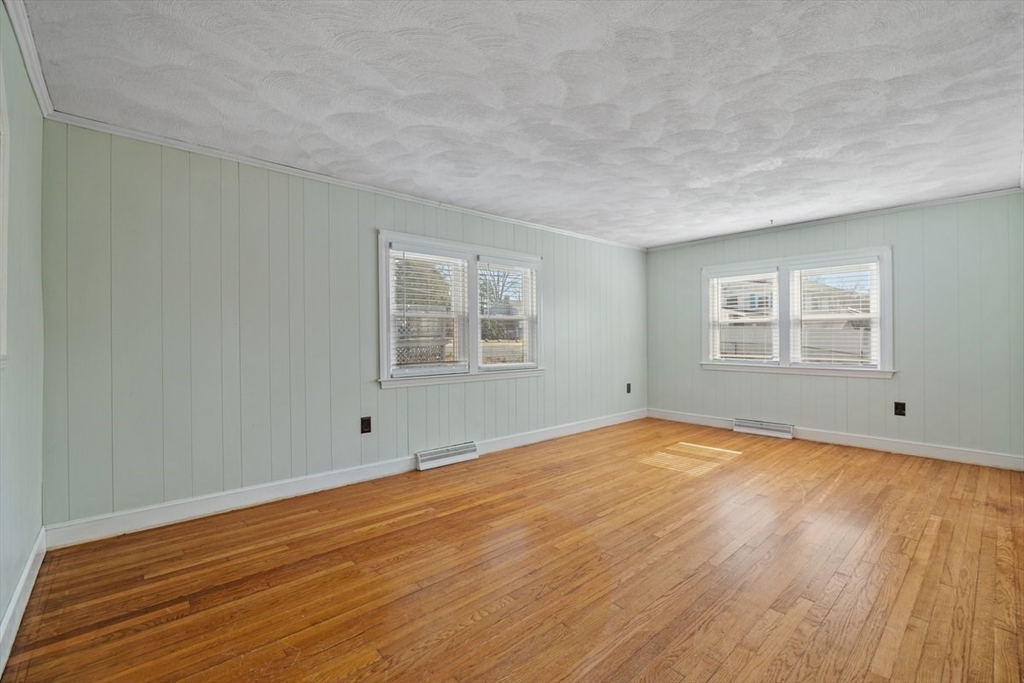 84 East Shore Road Holbrook, MA 02343 - Photo 8 of 26 a view of empty room with wooden floor and fan