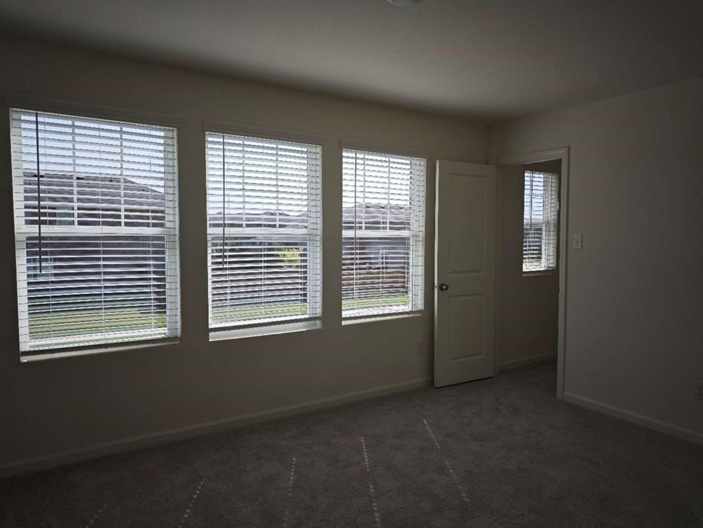 2111 Burnwood Street Melissa, TX 75454 - Photo 12 of 18 a view of an empty room with a window