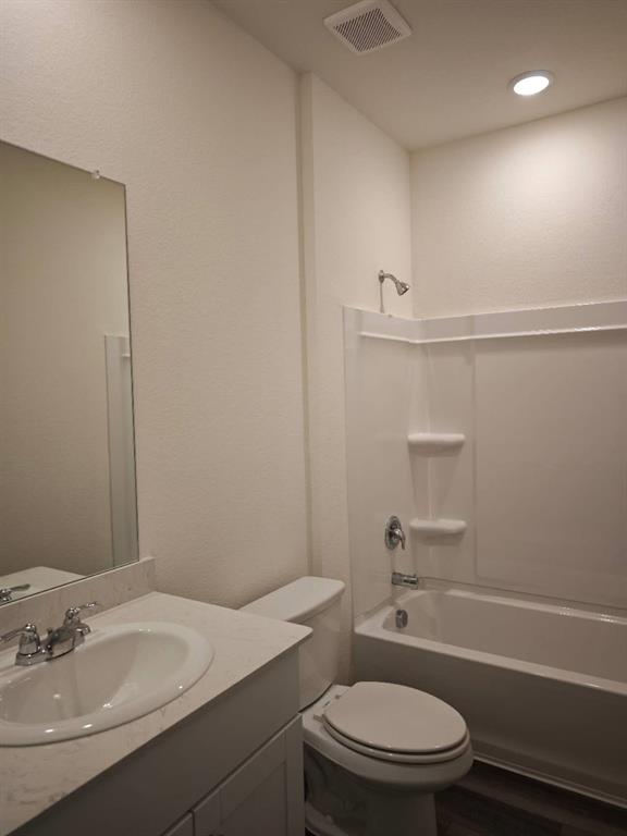 2111 Burnwood Street Melissa, TX 75454 - Photo 15 of 18 a bathroom with a sink a toilet and shower