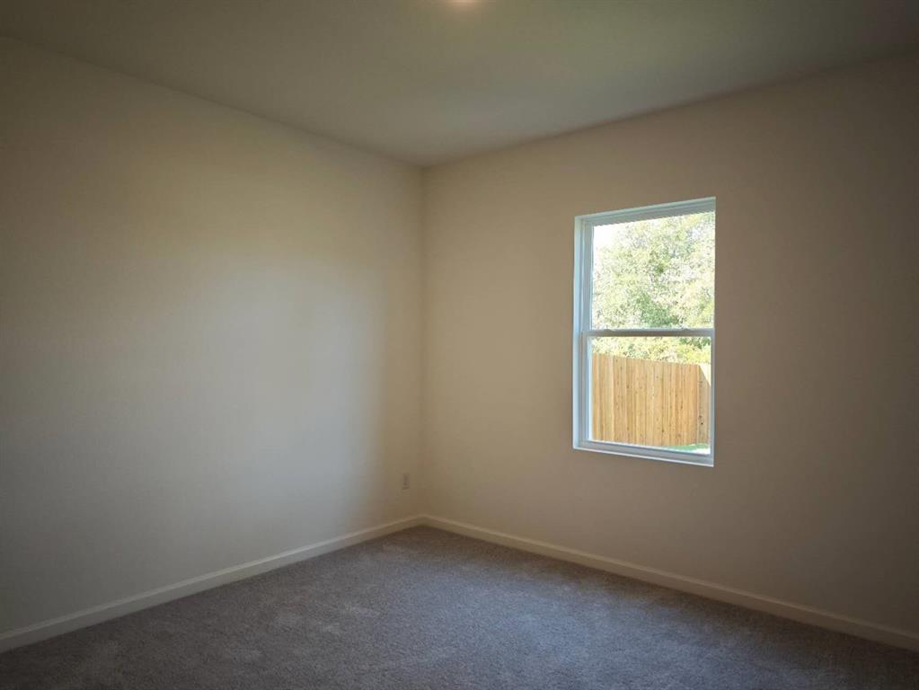 2111 Burnwood Street Melissa, TX 75454 - Photo 7 of 18 an empty room with a window
