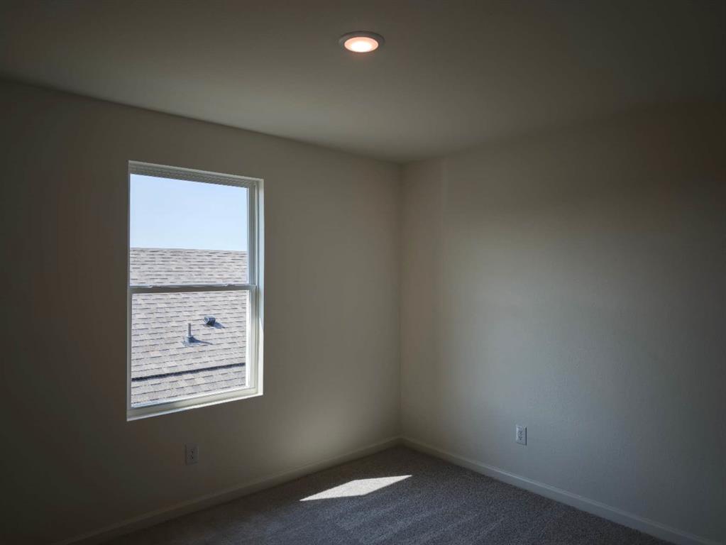 2111 Burnwood Street Melissa, TX 75454 - Photo 10 of 18 an empty room with a window