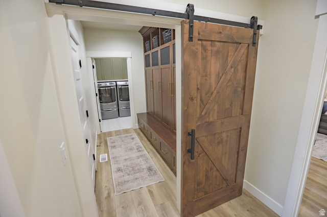 126 North 800 West Mapleton, UT 84664 - Photo 44 of 79 Mudroom with a barn door, light wood-style floors, and washer and clothes dryer