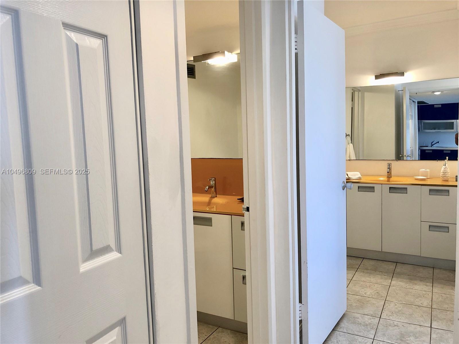 100 Lincoln Road, Unit 1423 Miami Beach, FL 33139 - Photo 12 of 54 Hallway to 1 and 1/2 bathrooms