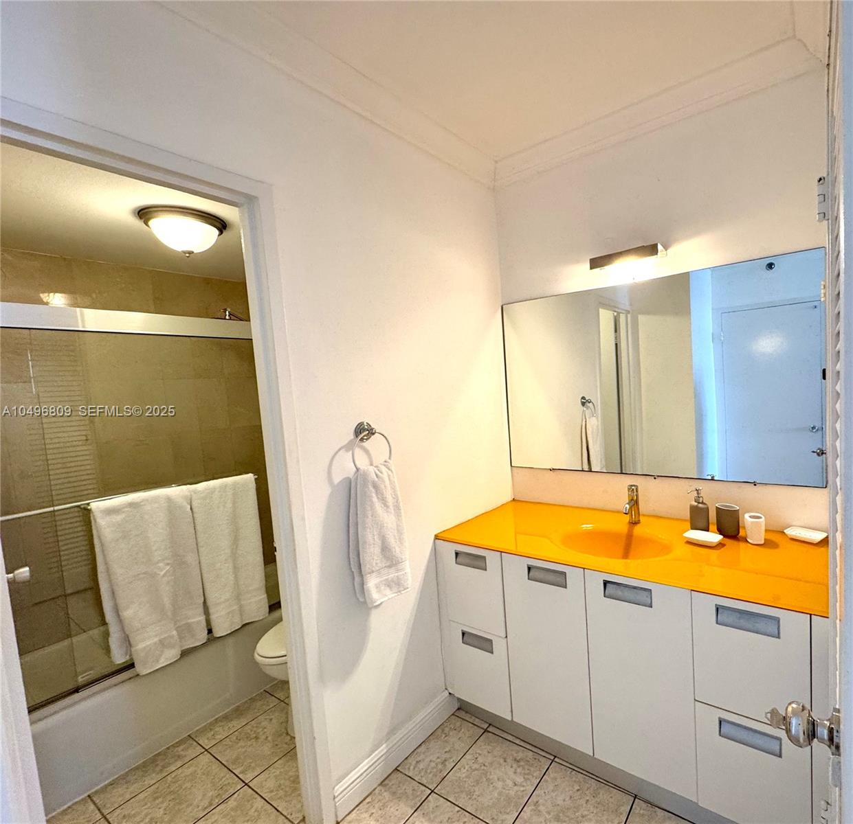 100 Lincoln Road, Unit 1423 Miami Beach, FL 33139 - Photo 14 of 54 a bathroom with a tub sink and mirror