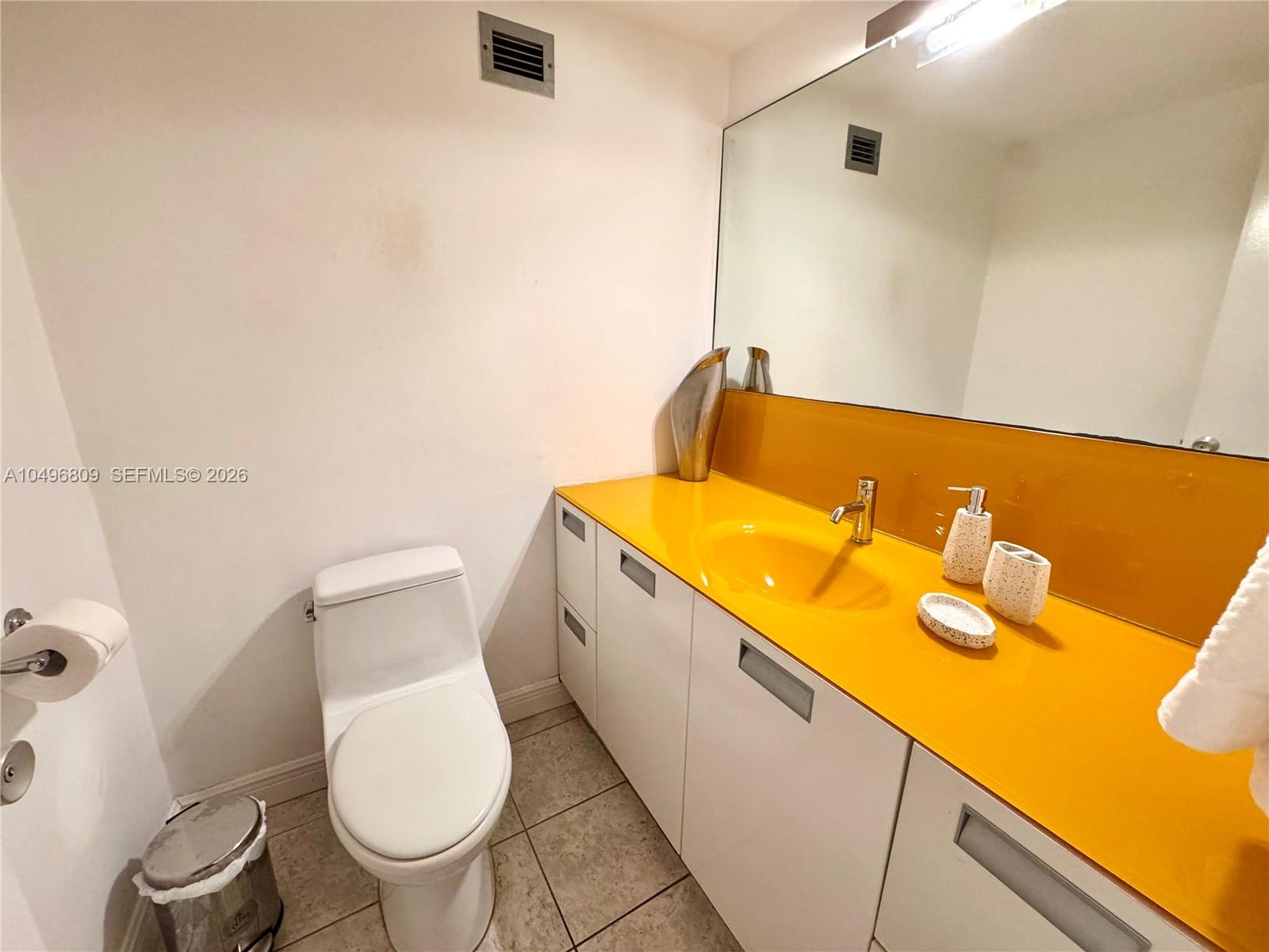 100 Lincoln Road, Unit 1423 Miami Beach, FL 33139 - Photo 15 of 56 a bathroom with a sink and a toilet
