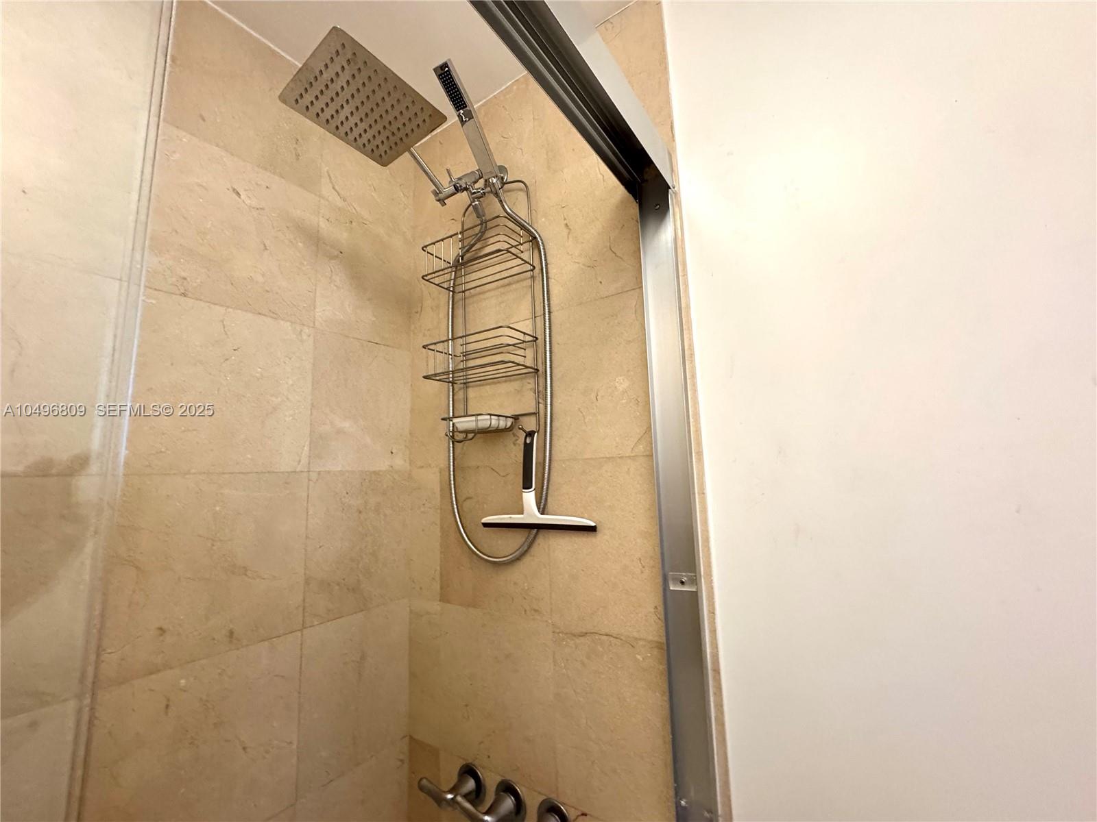 100 Lincoln Road, Unit 1423 Miami Beach, FL 33139 - Photo 16 of 54 a bathroom with a shower