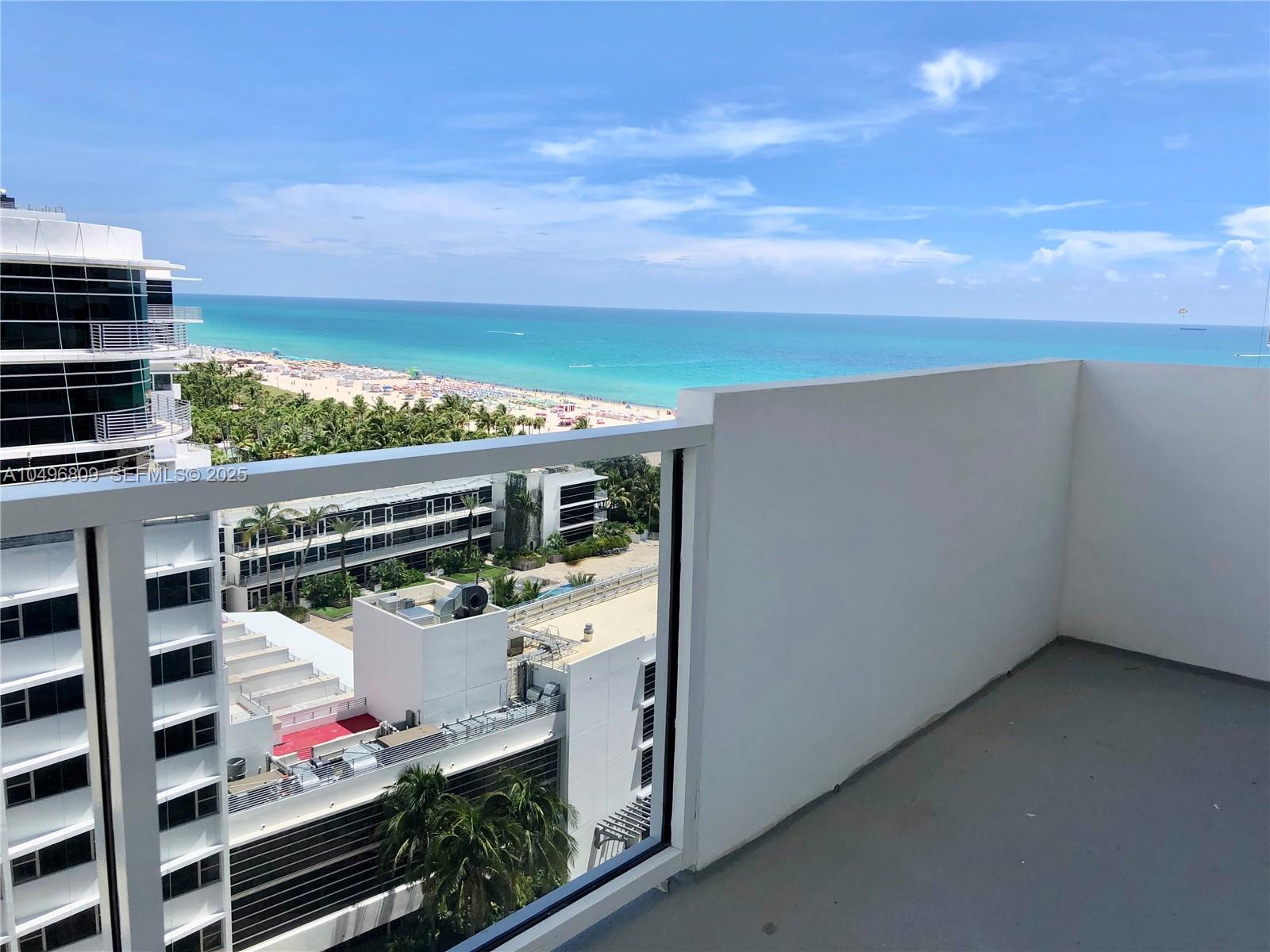 100 Lincoln Road, Unit 1423 Miami Beach, FL 33139 - Photo 18 of 54 a view of balcony with wooden floor and fence