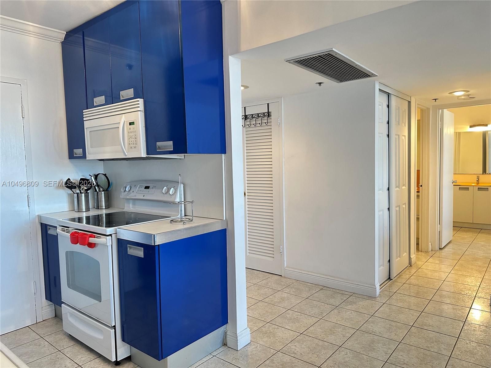 100 Lincoln Road, Unit 1423 Miami Beach, FL 33139 - Photo 8 of 56 a utility room with sink dryer and washer