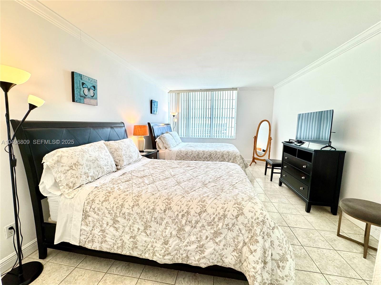 100 Lincoln Road, Unit 1423 Miami Beach, FL 33139 - Photo 9 of 54 a bedroom with a bed a couch and dresser