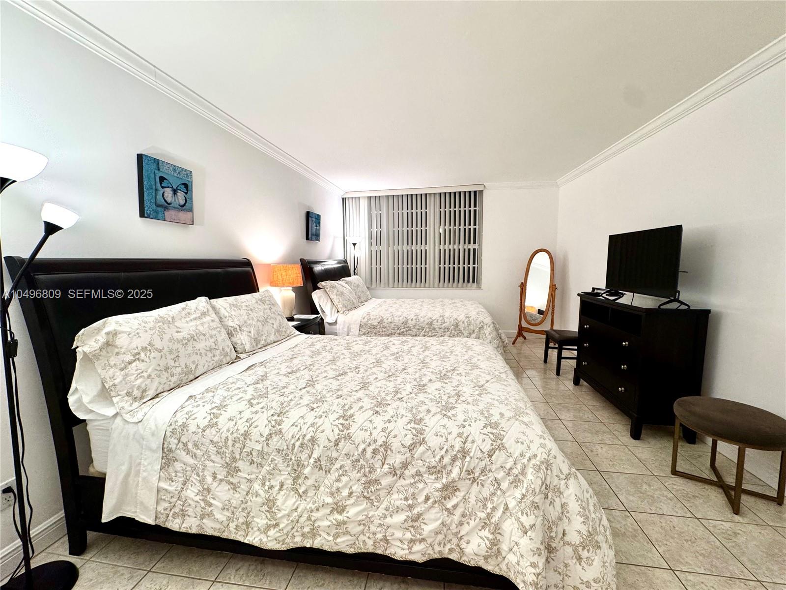 100 Lincoln Road, Unit 1423 Miami Beach, FL 33139 - Photo 10 of 54 a bedroom with a bed and wooden floor