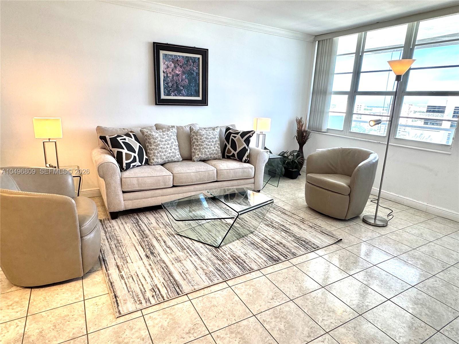100 Lincoln Road, Unit 1423 Miami Beach, FL 33139 - Photo 10 of 56 a living room with furniture and a window