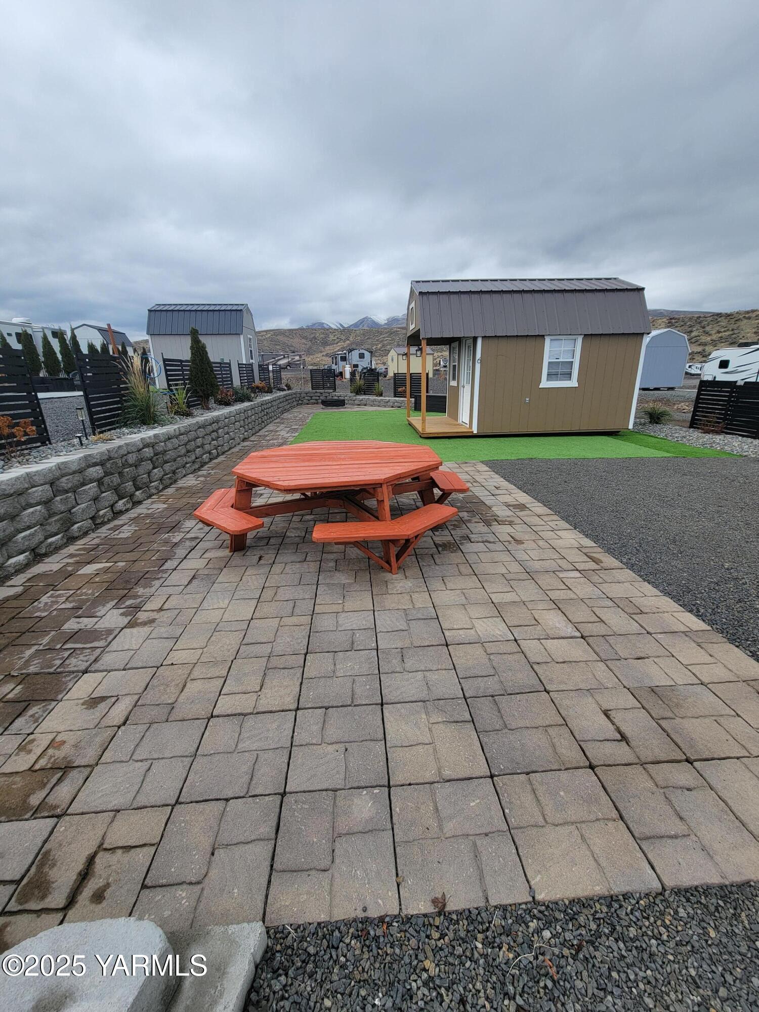 1769 Naches Wenas Road, Unit 6 Selah, WA 98942 - Photo 3 of 13 a backyard of a house with yard and barbeque oven