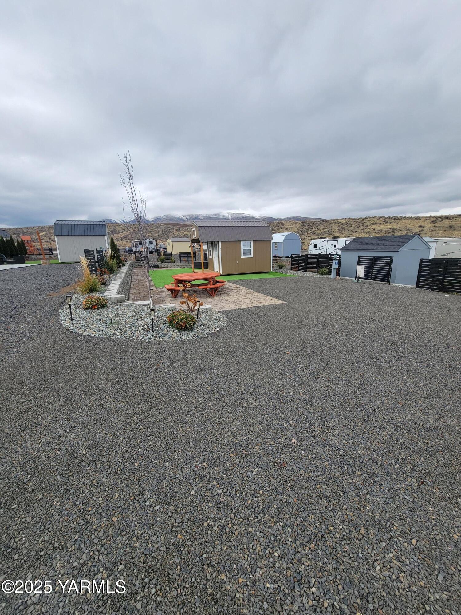 1769 Naches Wenas Road, Unit 6 Selah, WA 98942 - Photo 4 of 13 a view of a car is parked in a parking