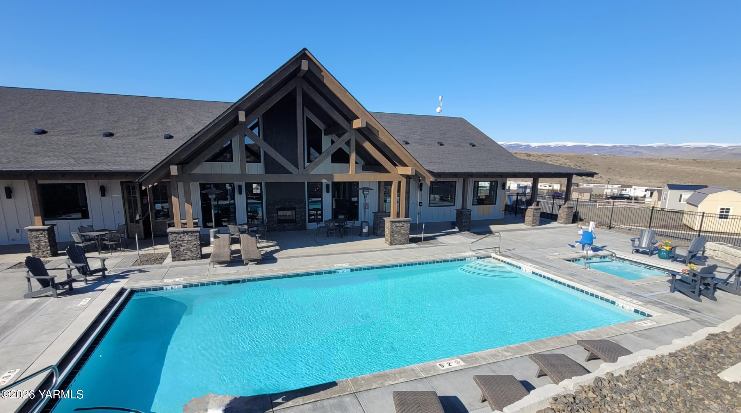 1769 Naches Wenas Road, Unit 6 Selah, WA 98942 - Photo 6 of 11 a view of a house with swimming pool and sitting area