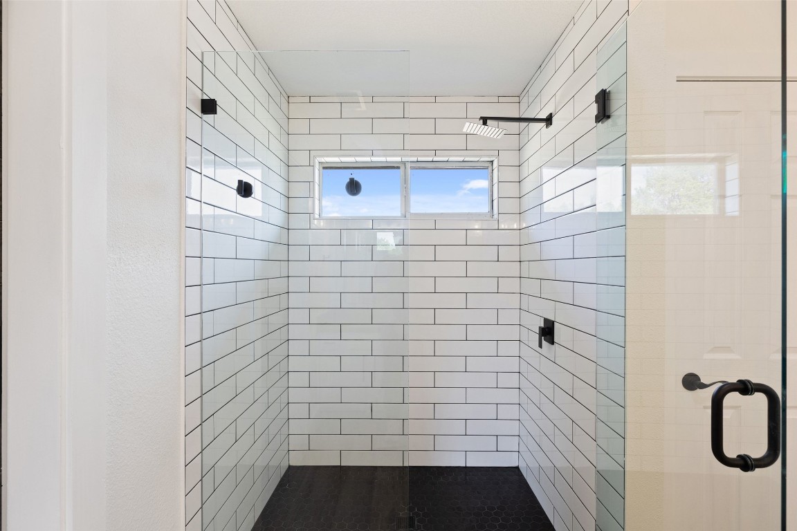 213 Beauchamp Road Dripping Springs, TX 78620 - Photo 20 of 40 a bathroom with a shower and a bathtub