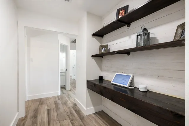 a view of workspace with wooden floor
