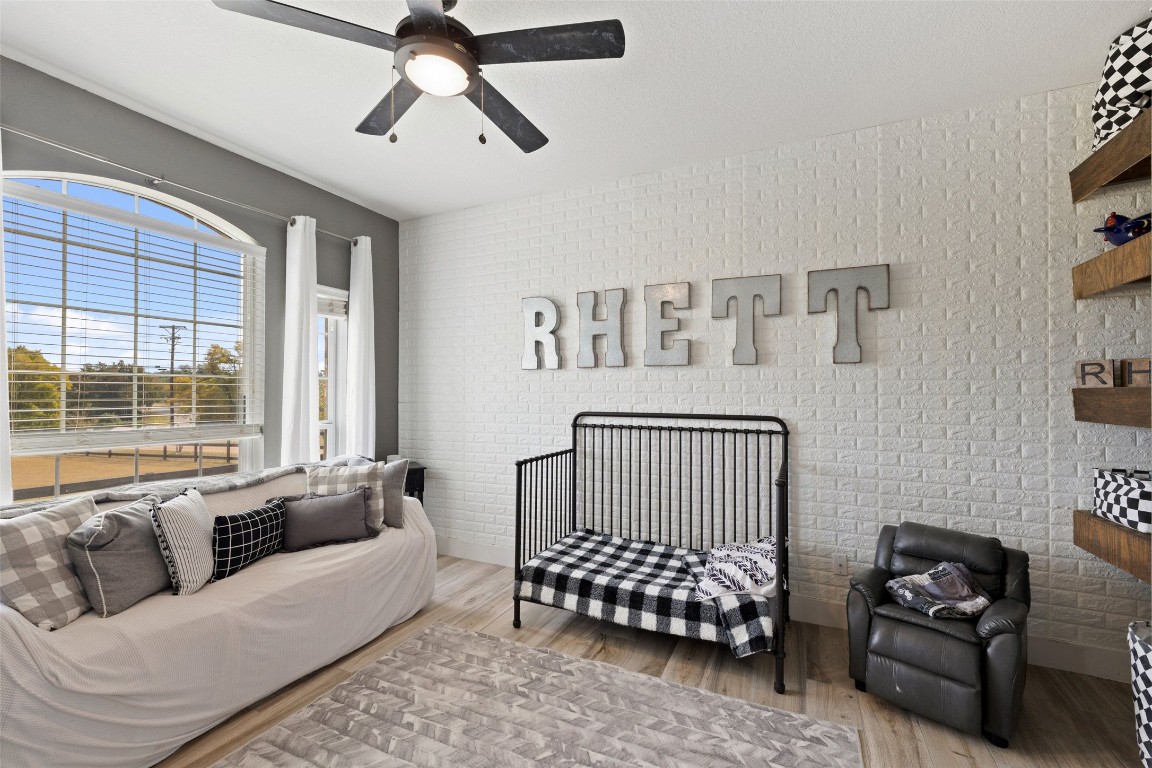 213 Beauchamp Road Dripping Springs, TX 78620 - Photo 28 of 40 a bedroom with a bed couch and window