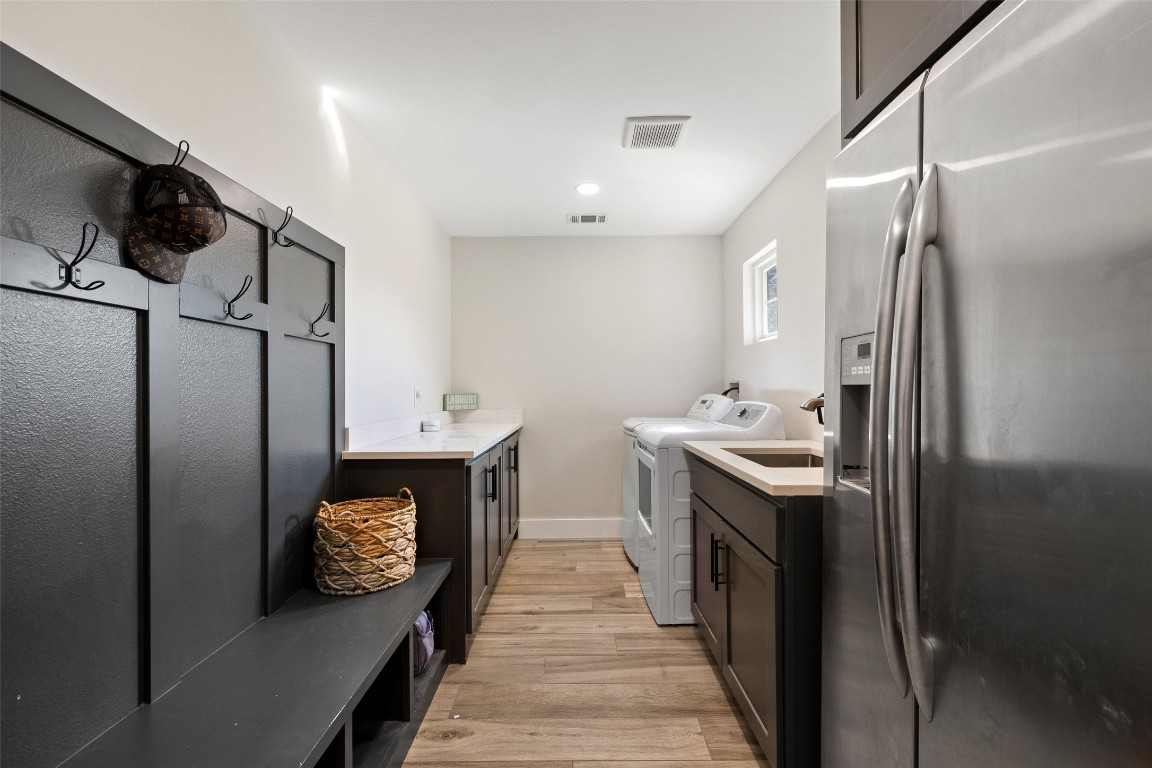 213 Beauchamp Road Dripping Springs, TX 78620 - Photo 30 of 40 a bathroom with a sink and a mirror