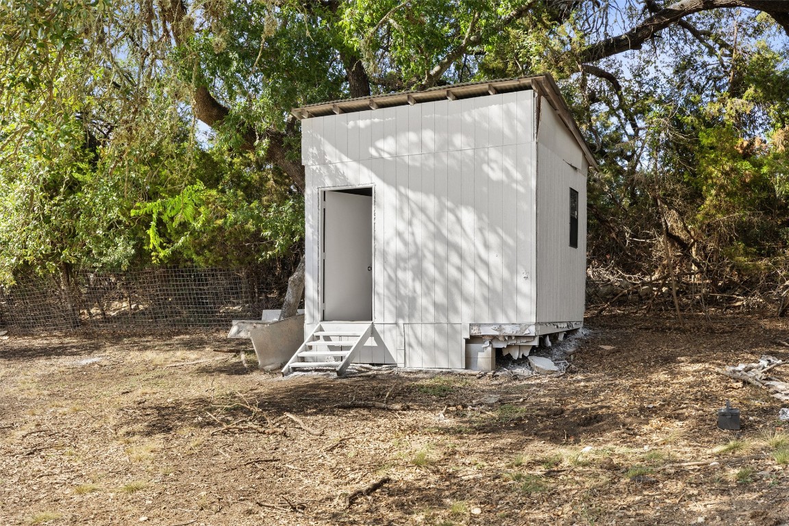 213 Beauchamp Road Dripping Springs, TX 78620 - Photo 39 of 40 a view of a house with backyard and trees