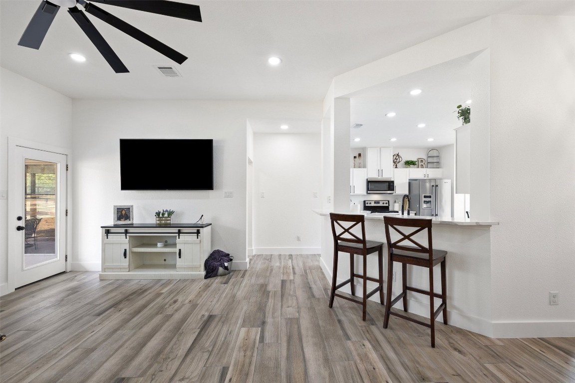 213 Beauchamp Road Dripping Springs, TX 78620 - Photo 8 of 40 a living room with furniture and a flat screen tv