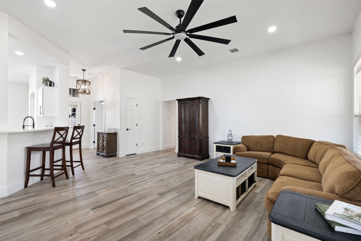 213 Beauchamp Road Dripping Springs, TX 78620 - Photo 9 of 40 a living room with furniture and a wooden floor