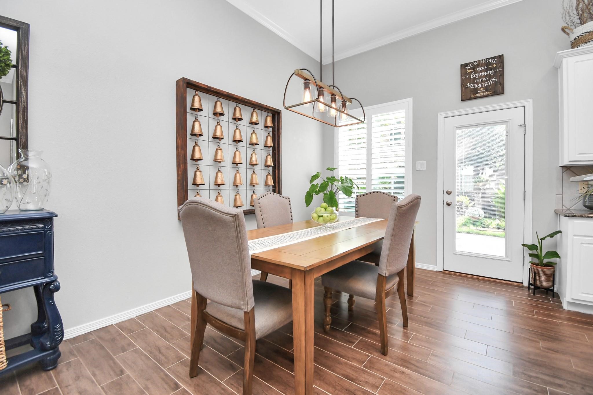 8624 Sunset Loch Drive Spring, TX 77379 - Photo 10 of 44 a view of a dining room with furniture window and wooden floor