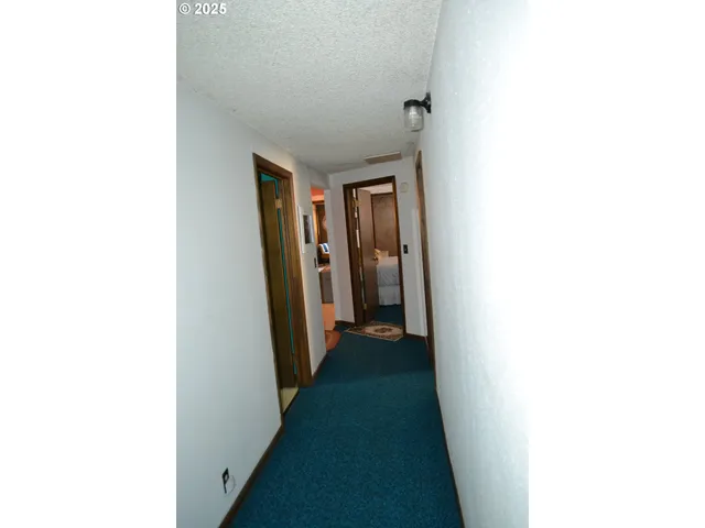 a view of a hallway with closet