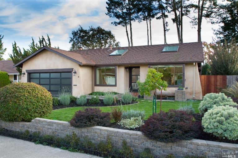 4 San Felipe Way Novato, CA 94945 - Photo 1 of 1 a front view of a house with a garden and plants