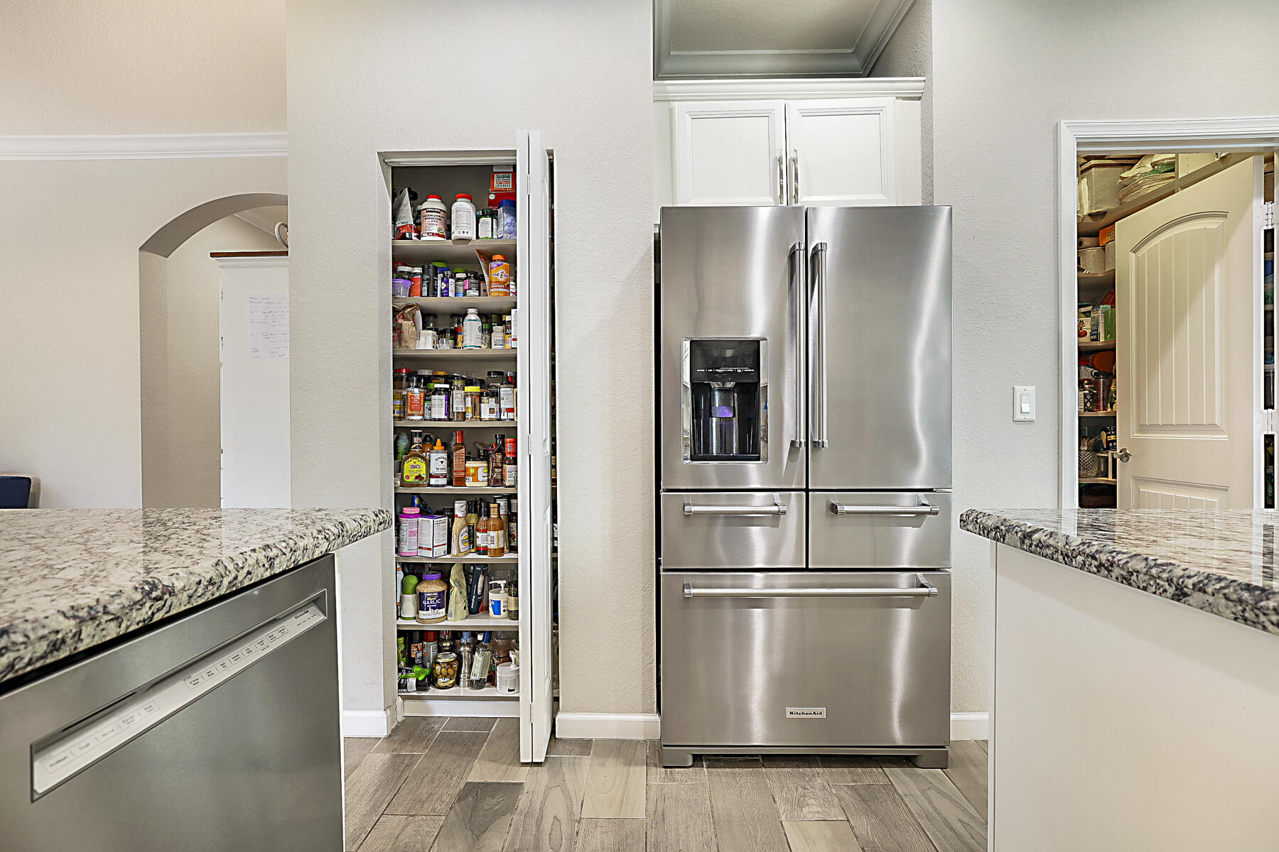 7131 Limestone Cay Road Limestone Creek, FL 33458 - Photo 19 of 65 a metallic refrigerator freezer sitting inside of a kitchen