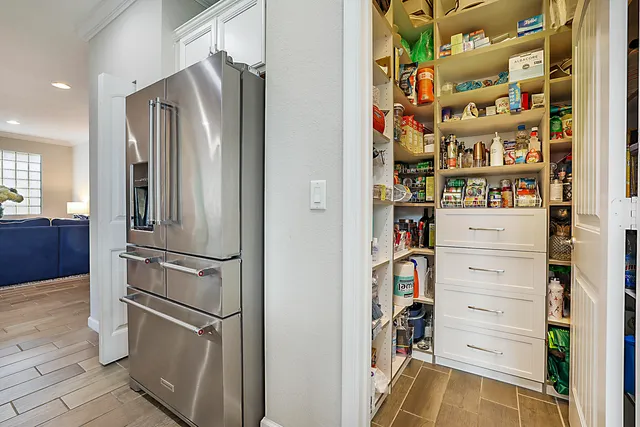a bedroom with a bed and a dresser in it
