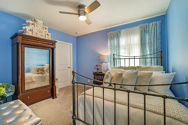 a bedroom with a bed and a table