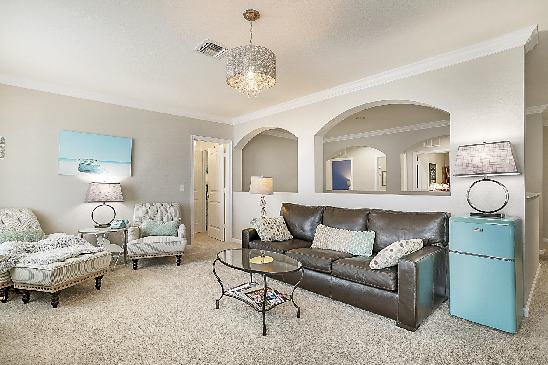 7131 Limestone Cay Road Limestone Creek, FL 33458 - Photo 39 of 65 a living room with furniture and a chandelier