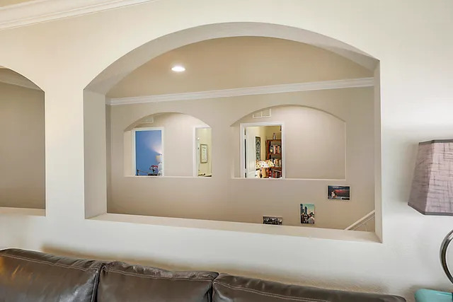 a view of swimming pool with outdoor seating and plants