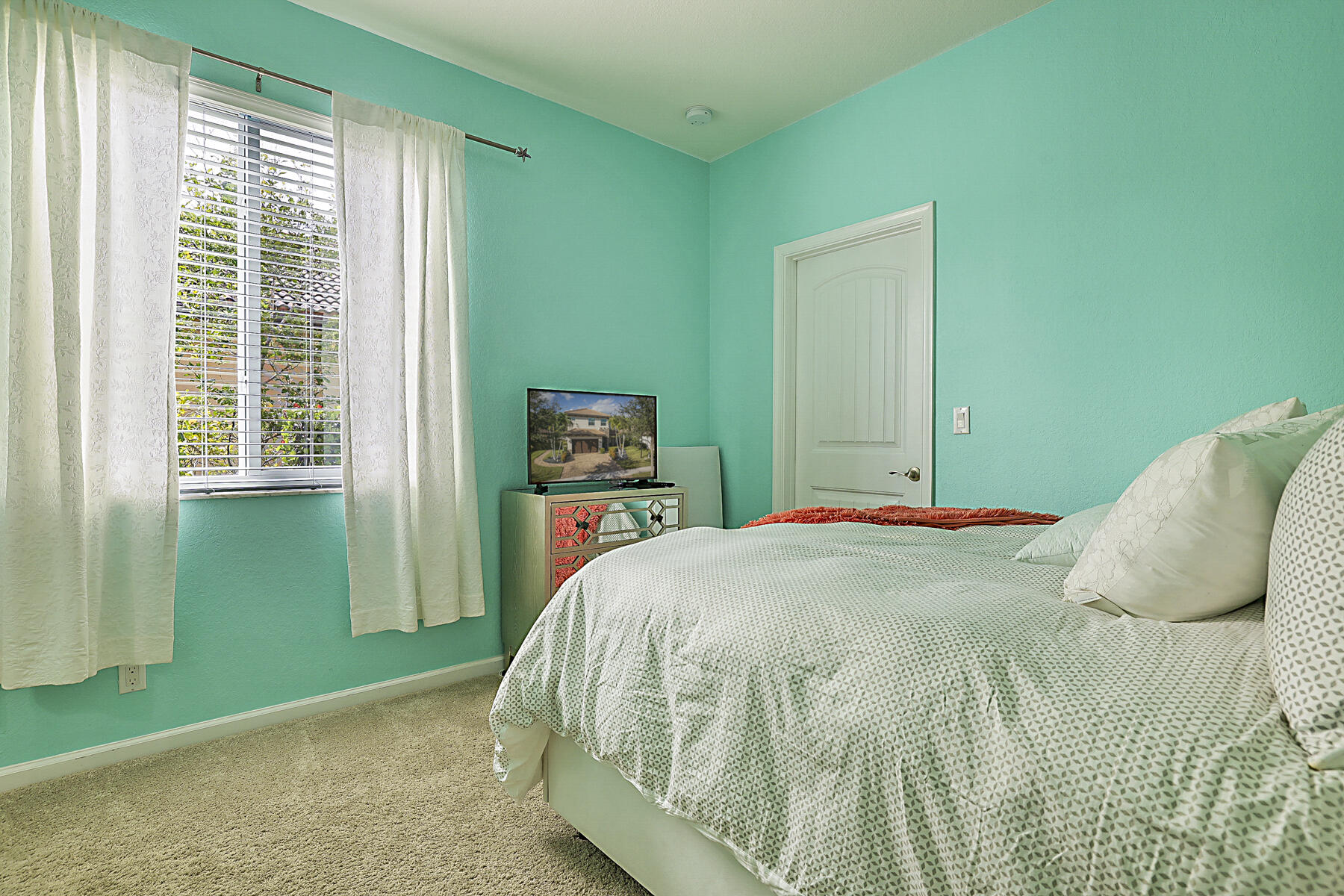 7131 Limestone Cay Road Limestone Creek, FL 33458 - Photo 41 of 65 a bedroom with a bed and a window